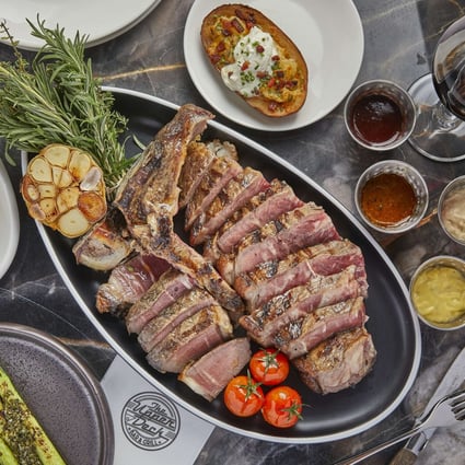 The Upper Deck’s 21- to 30-day dry-aged USDA porterhouse with side dishes. Photo: handout