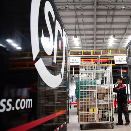 A worker moves parcels at an SF Express distribution centre ahead of the Singles Day online shopping festival, in Shenyang, Liaoning province in October 2018. Photo: Reuters