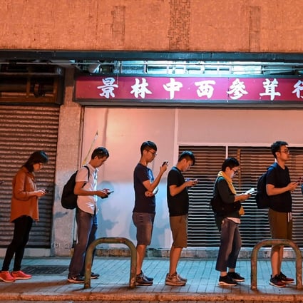 People queue to cast their votes in the 2019 district council elections in Tseung Kwan O, Hong Kong. Photo: AFP