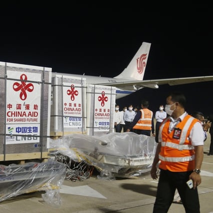 Workers transport the Sinopharm Covid-19 vaccine at the Phnom Penh International Airport in Cambodia. Photo: Xinhua