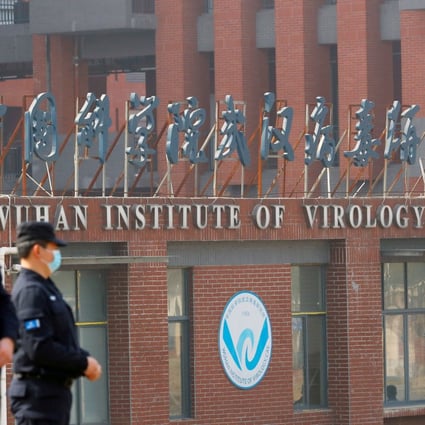 Security personnel keep watch outside the Wuhan Institute of Virology during the February visit by the World Health Organization (WHO) team. Photo: Reuters