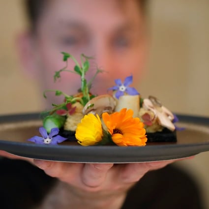 French chef Laurent Veyet displays a dish in his restaurant Inoveat, which serves insect-based food, in Paris, France, on May 12. Photo: Reuters