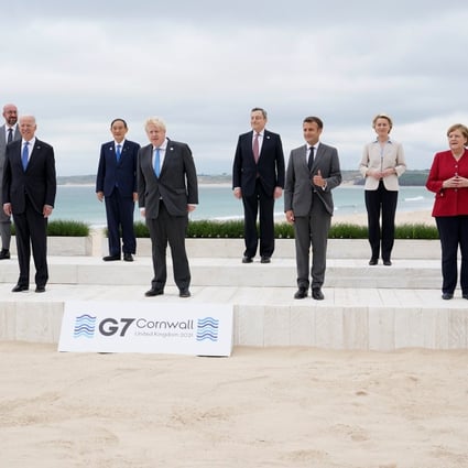 Leaders pose for a group photo at the G7 summit in Carbis Bay, Britain. Photo: Reuters