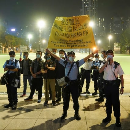 Hong Kong police officers stand at the entrance to Victoria Park to prevent people from gathering for the annual June 4 vigil in 2021, the 32nd anniversary of the crackdown on pro-democracy demonstrators at Beijing’s Tiananmen Square. Photo: Reuters