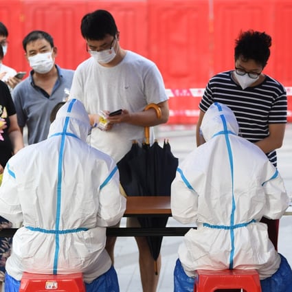 Residents from Guangzhou’s Liwan district register for Covid-19 tests as the city tries to contain an outbreak. Photo: Xinhua