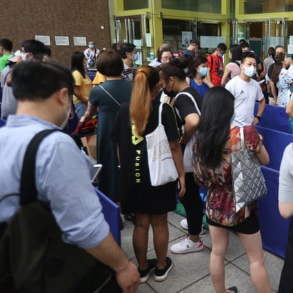 Hongkongers queue up to get their Covid-19 shots at the Community Vaccination Centre, Sun Yat Sen Memorial Park Sports Centre. Photo: K. Y. Cheng