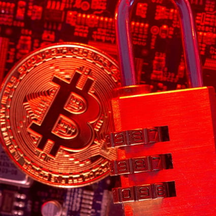 Representation of virtual currency Bitcoin and a padlock are placed on a computer motherboard in this illustration picture taken on May 4. Photo: Reuters