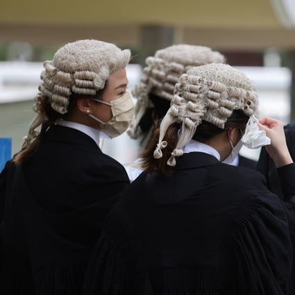 Legal practitioners feel the heat outside after an appointment ceremony for senior counsel at the Court of Final Appeal on May 29. Photo: Nora Tam 