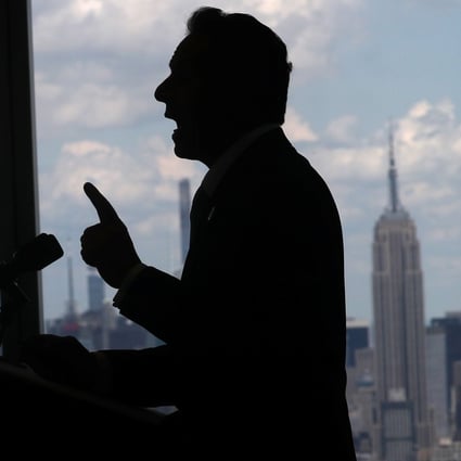 New York Governor Andrew Cuomo speaks with the skyline of Manhattan behind him on Tuesday as he announces the lifting of pandemic restrictions. Photo: Reuters