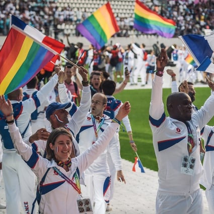 The French team march onto the field during the opening ceremony of the 2018 Gay Games at the Jean Bouin Stadium in Paris on August 4 that year. The Hong Kong edition in 2022 will feature 36 sporting events, expected to attract 12,000 participants and 75,000 spectators, and generate about HK$1billion in the local economy. Photo: AFP 