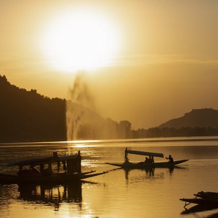 Small boats are seen at sunset on Dal Lake in Srinagar, the summer capital of Indian-administered Kashmir, earlier this month. Photo: Xinhua