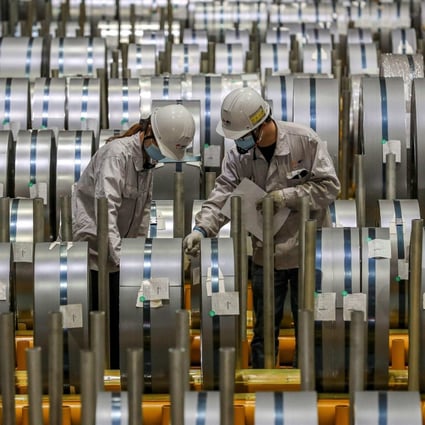 Workers check rolls of sheet aluminium at a factory in Wuhan, China, on May 8. According to the Institute of International Finance, more countries are seeing price mark-ups due to long delivery times and the rising cost of inputs into production. Photo: AFP
