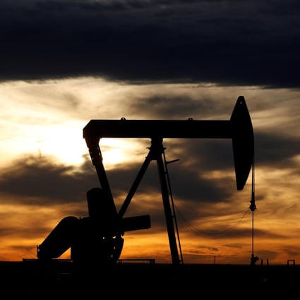 The sun sets behind a crude oil pump jack on a drill pad in the Permian Basin in Loving County, Texas, on November 24, 2019. Photo: Reuters