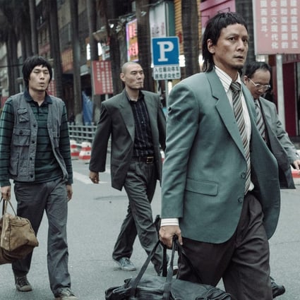 Daniel Wu (right) plays a bank robber in a still from Caught in Time (category IIB, Mandarin), directed by Lau Ho-leung.