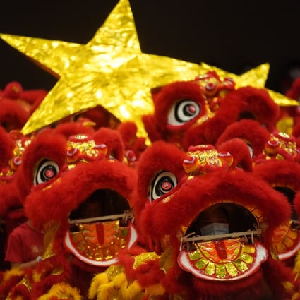 Red lions dance at the headquarters of the Heung Yee Kuk, an influential Hong Kong rural body, in Sha Tin on June 20, ahead of the 100th anniversary of the founding of the Communist Party of China in July. Photo: Sam Tsang