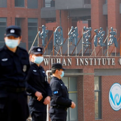 Security personnel keep watch outside the Wuhan Institute of Virology in Wuhan, Hubei province, during the visit by a WHO team tasked with investigating the origins of Covid-19,  on February 3. Photo: Reuters 