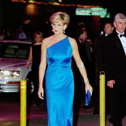 Diana, Princess of Wales wears a Versace one-shouldered satin blue gown  to the Victor Chang Cardiac Research Institute dinner dance at the Sydney Entertainment Centre, Australia, on October 31, 1996. Photo: Tim Graham Photo Library via Getty Images