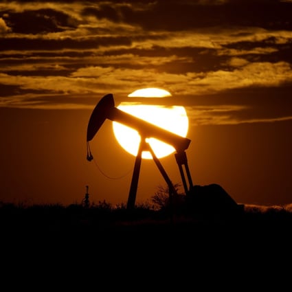 The sun sets behind an idle pump jack near Karnes City, Texas, on April 8, 2020. In the US, the Biden administration has adopted an “all-of-government” approach to hobble domestic oil and gas production and fight climate change. Photo: AP 