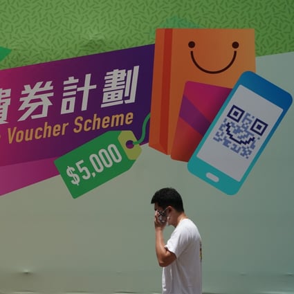 A banner advertises the Hong Kong government’s consumption voucher scheme in Sham Shui Po. Photo: Felix Wong