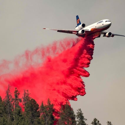 An air tanker drops retardant along a ridge during a fire in Lakehead, California on July 2. As extreme weather events mount, ESG investment is a very indirect and almost certainly ineffective way of funding climate action. Photo: AFP