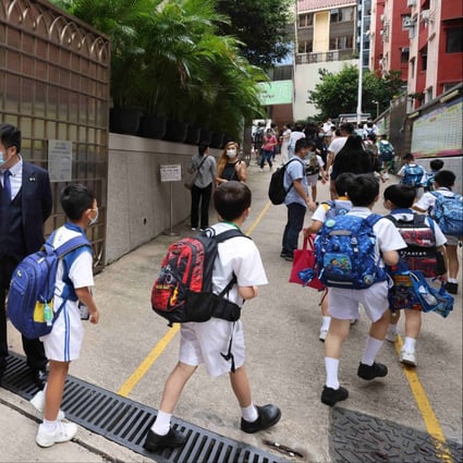 Students arrive at Tak Sun School in Jordan on June 16. Hong Kong students deserve a round of applause for completing this school year, which was no less challenging than the last. Photo: Nora Tam