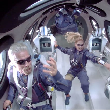 Sir Richard Branson (left) and other crew members attain zero gravity during their Virgin Galactic space flight. Photo: EPA-EFE