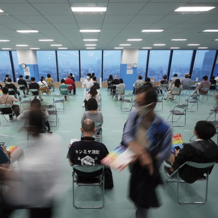 Residents rest after receiving their first dose of the Moderna Covid-19 vaccine at a vaccination centre at Tokyo Skytree in Tokyo on June 30. Japan’s efforts to fight Covid-19 have been hampered by a slow vaccine rollout. Photo: AP