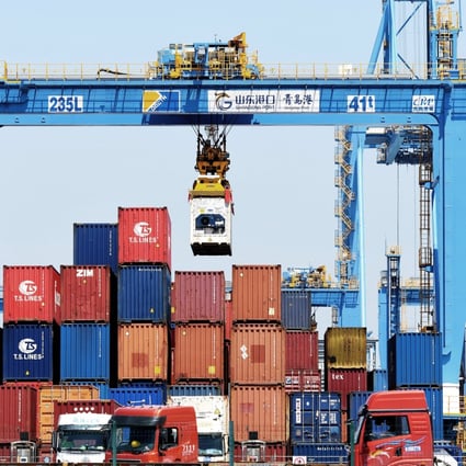 A gantry crane moves containers at a port in Qingdao, in eastern China’s Shandong province, on June 4. Photo: AP