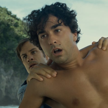 Alex Wolff (front) and Gael García Bernal in a scene from beach horror Old (category: IIB), written and directed by M. Night Shyamalan.