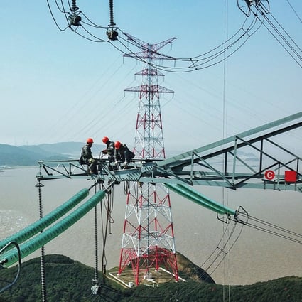 Technicians from the State Grid Zhejiang Electric Power Company, a subsidiary of the national power company State Grid, check power lines in Zhoushan, Zhejiang. In China, state-owned enterprises employ about a fifth of the labour force – about 70 million people – the equivalent of almost the entire population of France. Photo: Xinhua