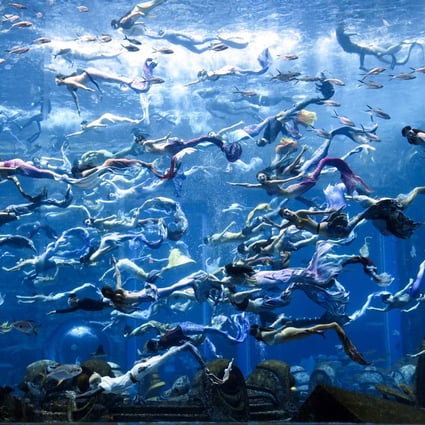 Divers set a new Guinness World Record for the “largest underwater mermaid show” at Atlantis resort in Sanya, Hainan Province, China. Photo: Getty Images