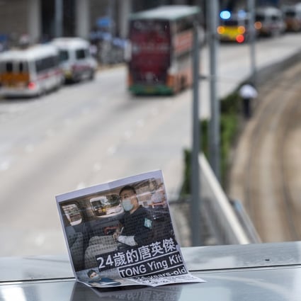 A flyer lies on the ground in support of Leon Tong Ying-kit, the first person convicted under the Hong Kong national security law, near the High Court in Hong Kong on July 30. Tong was sentenced to nine years in prison for driving his motorcycle into a group of police officers last year while flying a flag calling for the city’s “liberation”. Photo: EPA-EFE