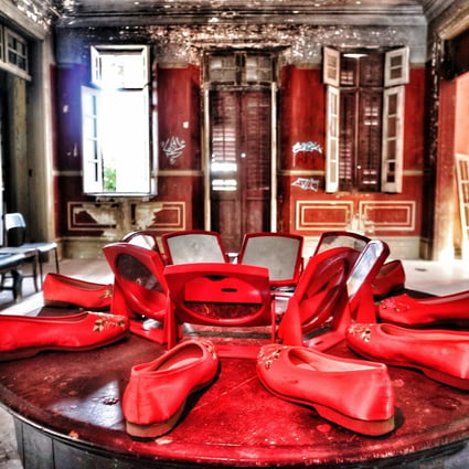 Ten red embroidered shoes and eight mirrors left in formation, as if they were part of a ceremony, at a deserted English-style mansion in Hong Kong. The photo forms part of the “Vanishing Hong Kong” exhibition, to be held from August 17 to 29. Photo: P.H. Yang