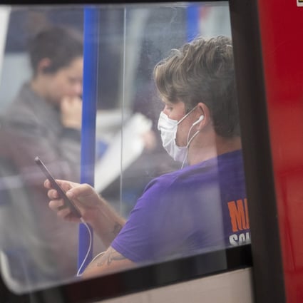 A headphone-wearing commuter in London. A study by audio firm Jabra reveals more than a third of British headphone users wear them to avoid having to talk to other people, and that the average Briton goes five weeks without speaking to someone new. Photo: Getty Images