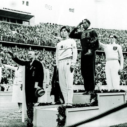 Bronze medallist in the long jump Naoto Tajima of Japan, gold medallist Jesse Owens of the United States and silver medallist Lutz Long of Germany salute during the medals ceremony on August 11, 1936, at the Summer Olympics in Berlin. Owens dominated the 1936 games with four gold medals, refuting Nazi claims of white racial superiority; he and Long reportedly became lifelong friends. Photo: AP 