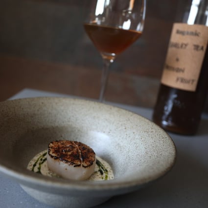 Barley tea and passionfruit paired with scallop, celtuce, pike perch at Aulis in Causeway Bay. At this and other Hong Kong restaurants, non-alcoholic drink and food pairings take the same care as food and wine pairings. Photo: Jonathan Wong