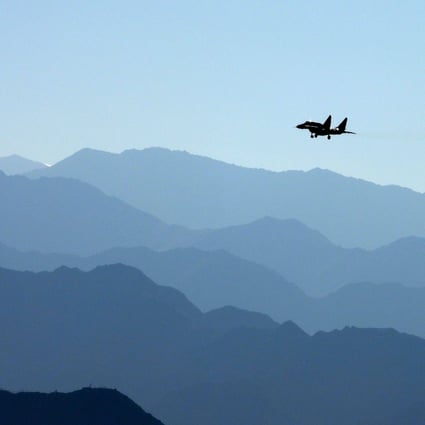 An Indian Air Force fighter jet flies over a mountain range in Leh, the joint capital of the union territory of Ladakh, bordering China, in September 2020. Photo: AFP