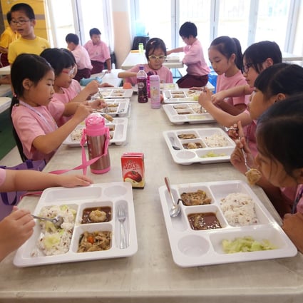 Students enjoy their lunch at a school in in Tsing Yi in May 2016. The current half-day arrangement at most schools in Hong Kong is meant to reduce the chances of Covid-19 spreading. Photo: David Wong