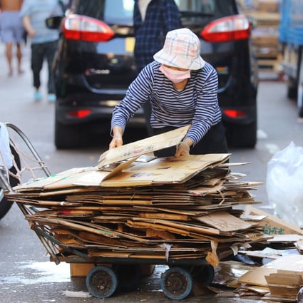 An elderly woman collects cardboard on the streets in Sham Shui Po in December 2020. The poor have been disproportionately affected by the economic fall-out of Covid-19. Photo: Dickson Lee