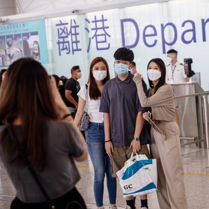 Friends and relatives take photos before boarding a London-bound flight at Hong Kong airport on August 8. Photo: EPA-EFE
