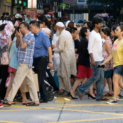 People of various ethnicities cross the road in Tsim Sha Tsui in August 2018. Hong Kong’s Race Discrimination Ordinance  makes it unlawful for a service provider to refuse to provide goods, services or facilities on the grounds of a person’s race. Photo: Fung Chang