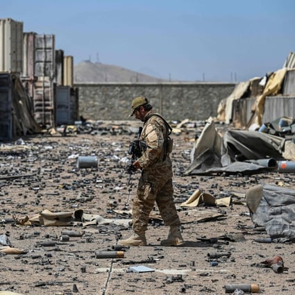 A member of a Taliban military unit walks amid debris of the destroyed Central Intelligence Agency base in Deh Sabz district, northeast of Kabul, Afghanistan, on September 6. Photo: AFP