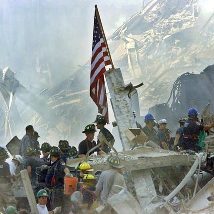 A US flag is posted in the rubble of the World Trade Centre in New York  on September 13, 2001. On September 11, 2001, during a series of coordinated terror attacks using hijacked airplanes, two airplanes were flown into the World Trade Centre’s twin towers causing the collapse of both towers. Photo: EPA-EFE