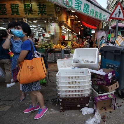 Rubbish is piled up next to a bin in Sham Shui Po on August 26. Photo: Felix Wong