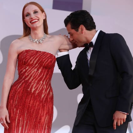 Images of Oscar Isaac (right) kissing the inside of Jessica Chastain’s bare arm on the red carpet at the Venice Film Festival went instantly viral. Photo: Getty Images