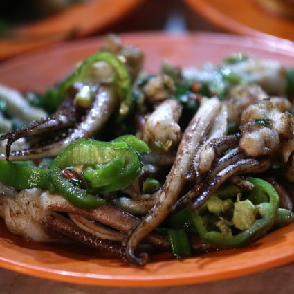 Squid in salt and pepper from Sing Kee in Central. American architect and illustrator Tom Schmidt takes visitors there for an authentic Hong Kong street food experience. Photo: Jonathan Wong