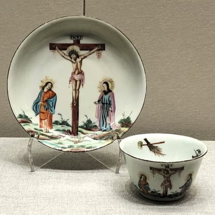 This 18th-century cup and saucer set, part of the CUHK art museum exhibition, was first made in China without decoration and then fired with overglaze painting in the Netherlands. Both the cup and saucer depict the crucifixion of Jesus Christ. Photo: Enid Tsui