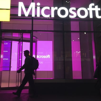 People walk near a Microsoft office in New York in November, 2016. Large tech firms such as Microsoft have been accused of stifling innovation through their acquisitions and competitive practices. Photo: AP
