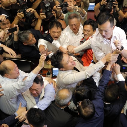 Pro-democracy and pro-government lawmakers scuffle over access to the Legislative Council chamber on May 11, 2019, amid a broader clash over controversial amendments to Hong Kong’s extradition laws. Photo: AP
