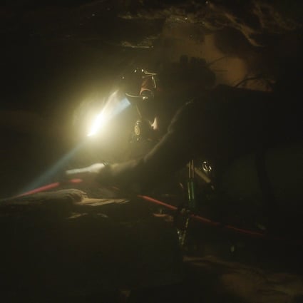 A scene from The Rescue showing a diver navigating through an underwater cave. Photo: National Geographic